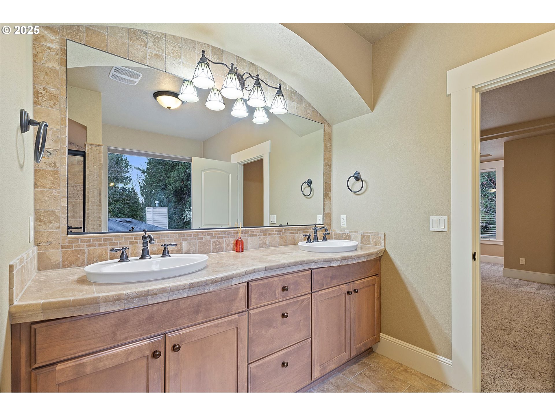 2875 Southeast Elliott Drive Gresham, OR 97080 - Photo 35 of 48 a bathroom with a granite countertop sink a large mirror and a