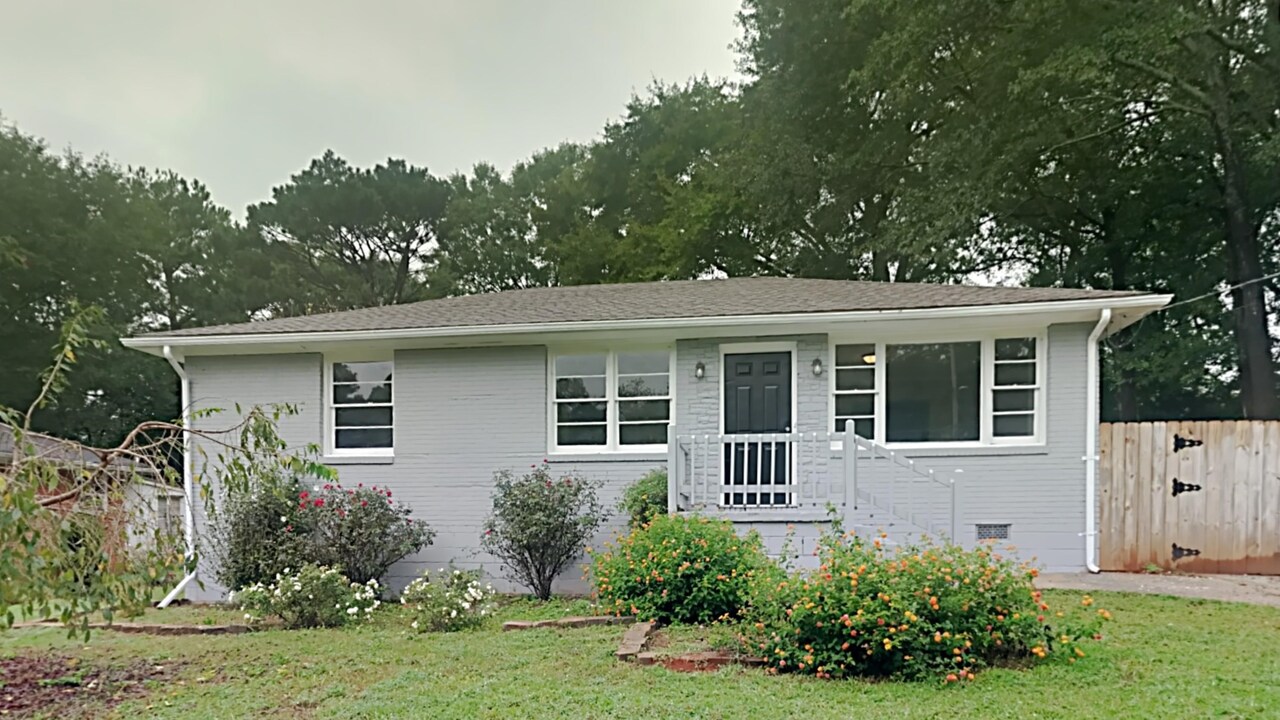 1390 Richard Road Decatur, GA 30032 - Photo 1 of 1 front view of a house with a yard