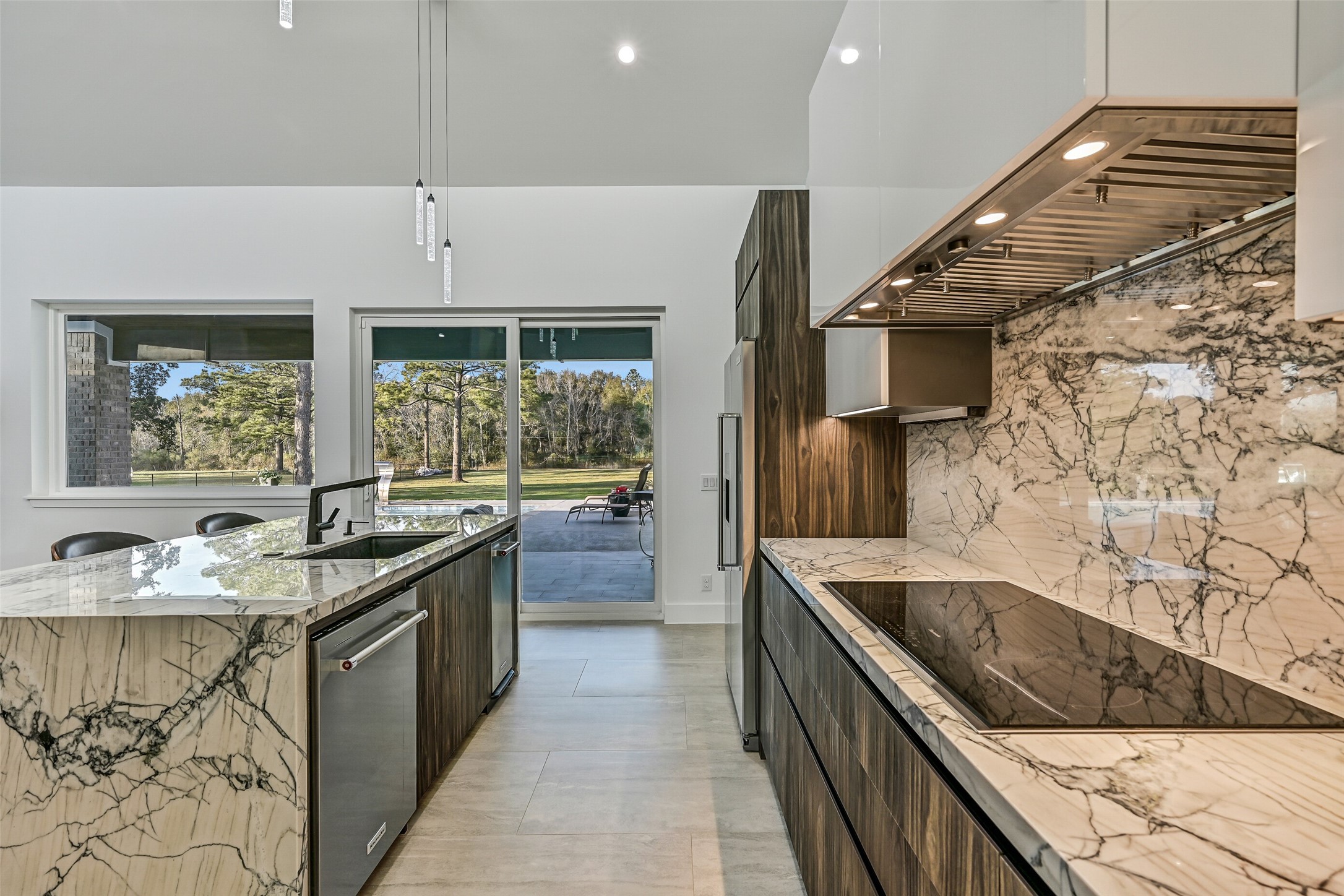 7627 Scott Avenue Manvel, TX 77578 - Photo 19 of 50 a kitchen with stainless steel appliances granite countertop a sink and a stove