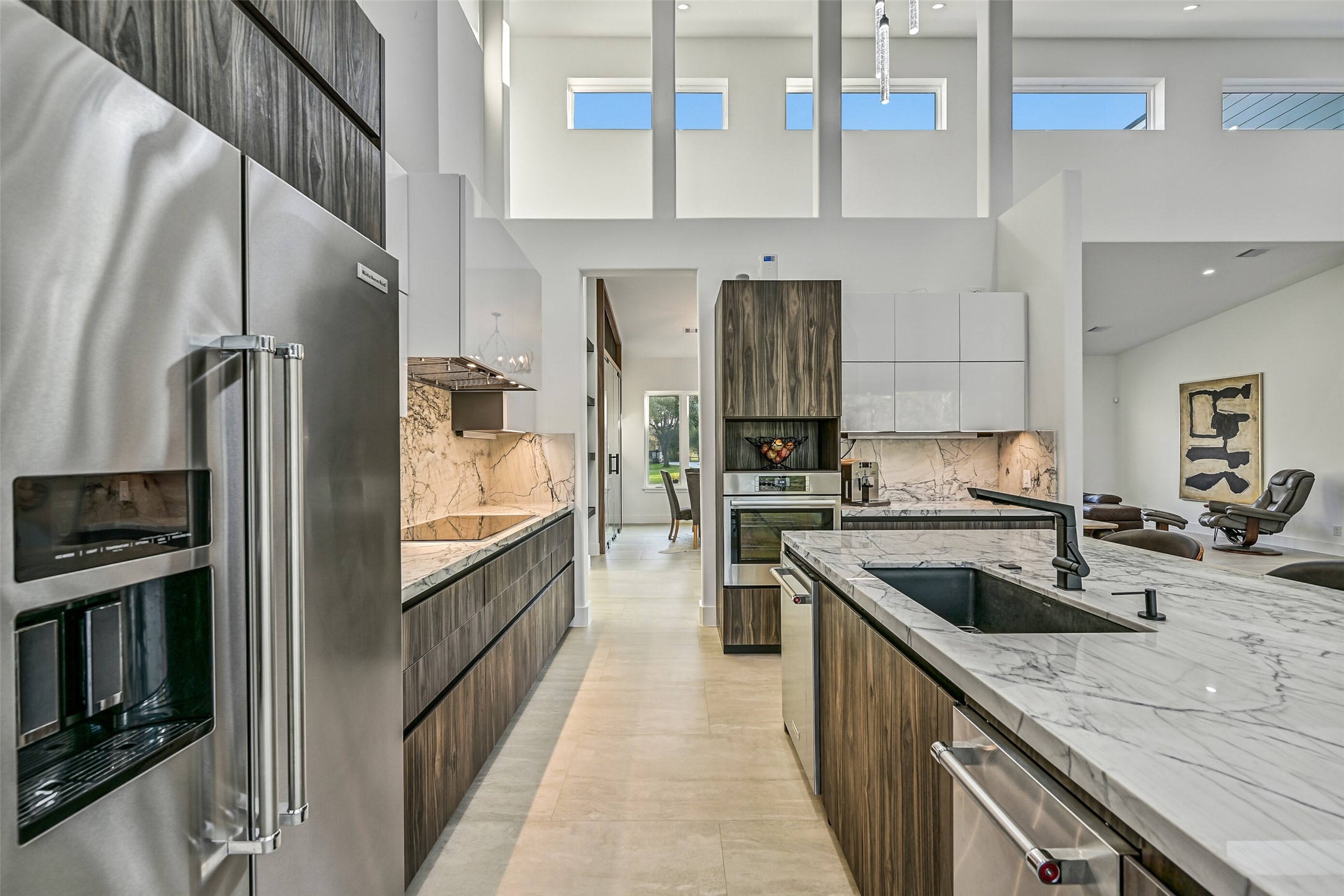 7627 Scott Avenue Manvel, TX 77578 - Photo 21 of 50 a kitchen with stainless steel appliances granite countertop a refrigerator a stove and a sink with wooden floor