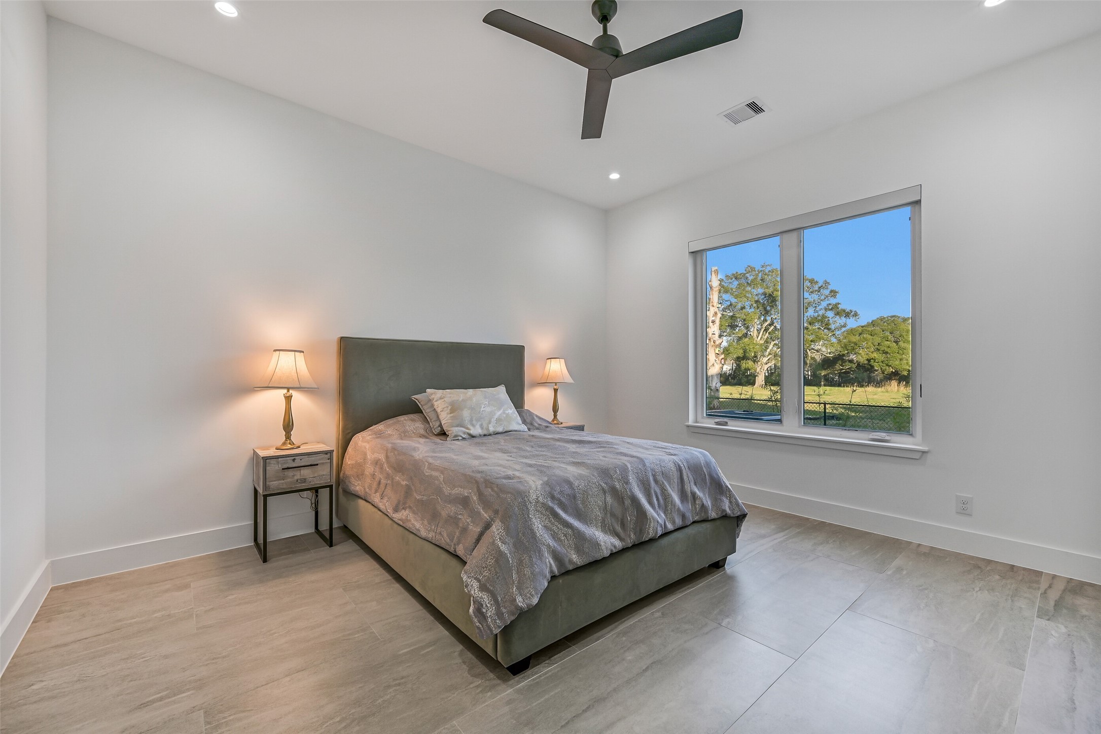 7627 Scott Avenue Manvel, TX 77578 - Photo 28 of 50 a bedroom with a bed and a painting on the wall
