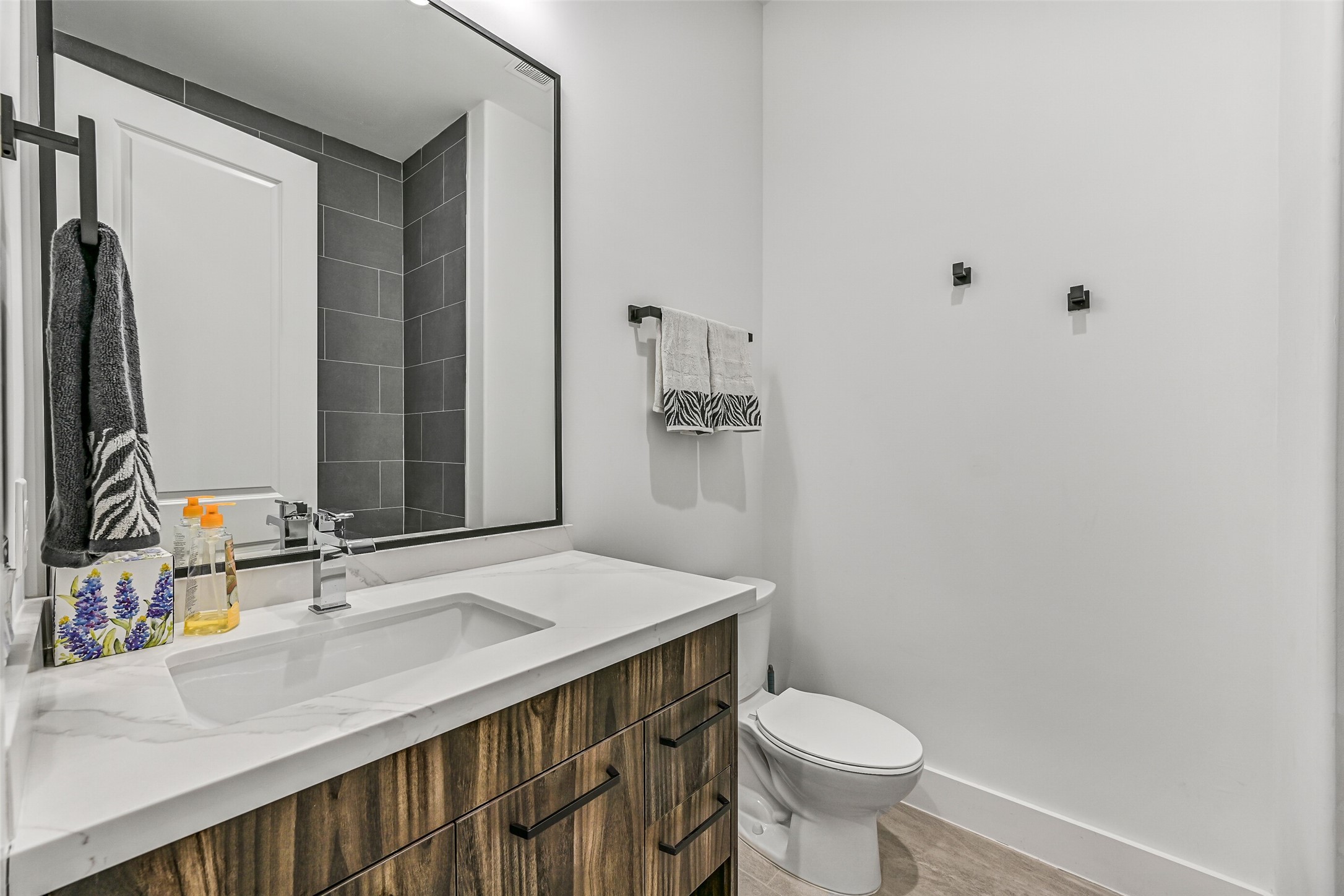 7627 Scott Avenue Manvel, TX 77578 - Photo 31 of 50 a bathroom with a sink toilet and mirror