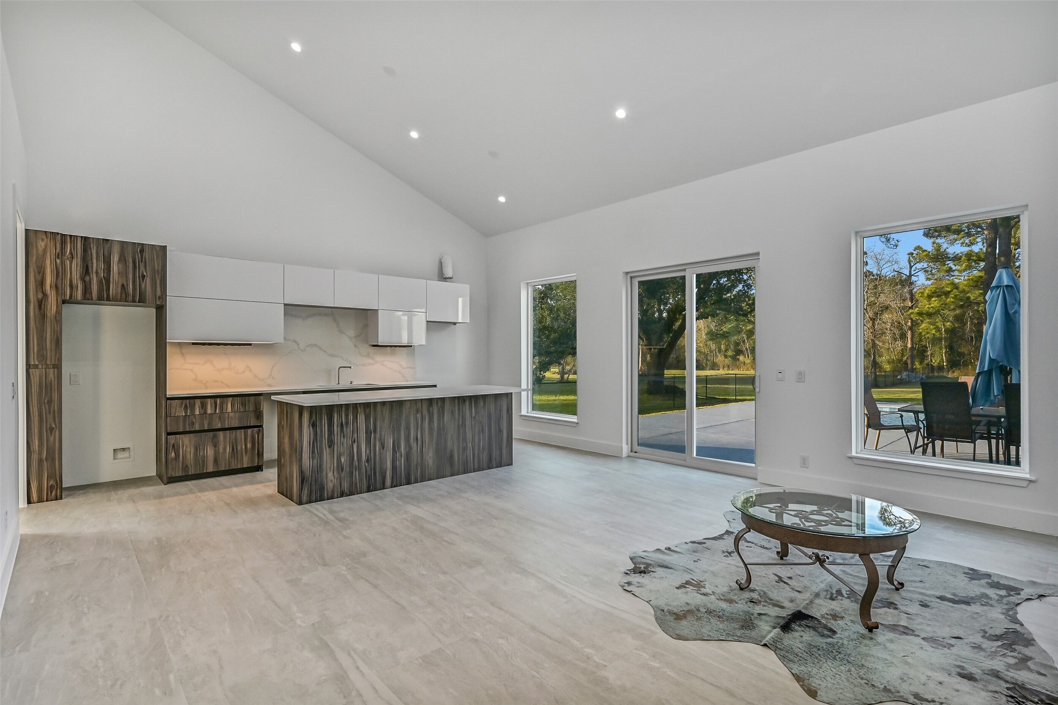 7627 Scott Avenue Manvel, TX 77578 - Photo 39 of 50 a living room with furniture a window and kitchen appliances