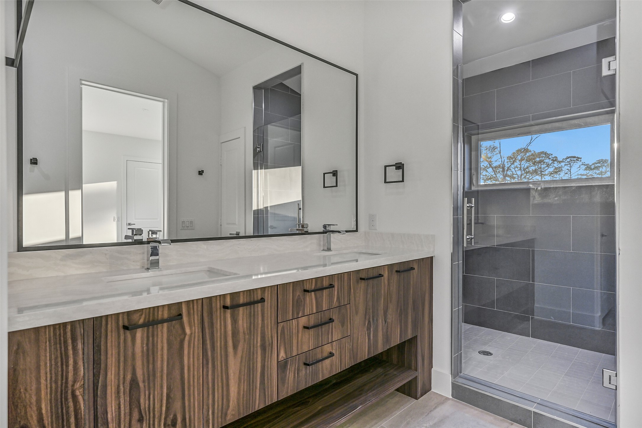 7627 Scott Avenue Manvel, TX 77578 - Photo 43 of 50 a bathroom with a granite countertop sink and a mirror
