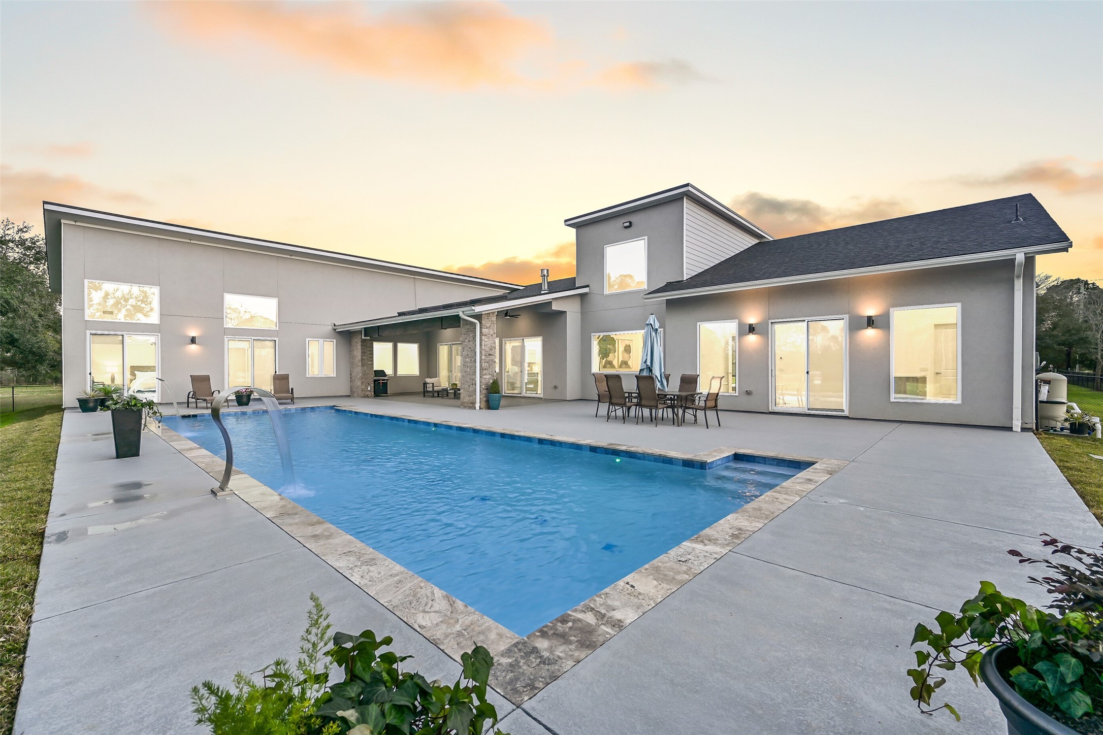 7627 Scott Avenue Manvel, TX 77578 - Photo 48 of 50 a front view of a house with a garden and patio