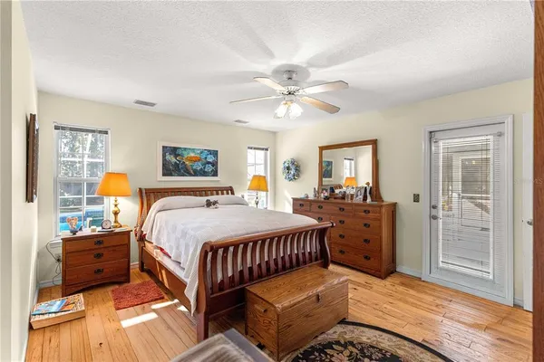 a bed room with a bed and a lamp