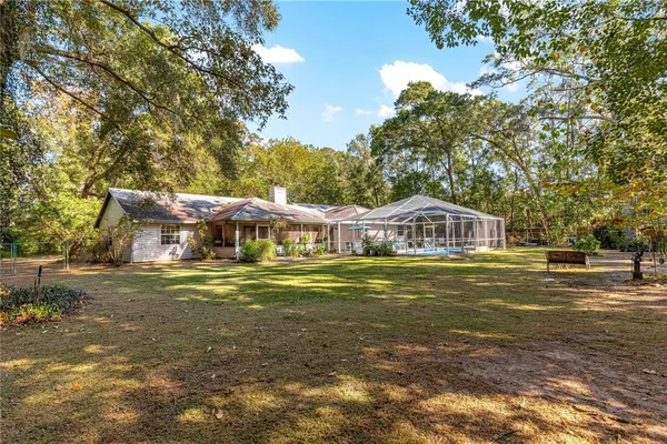 a view of a house with a yard