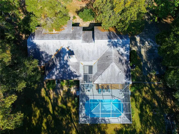 an aerial view of residential houses with city view
