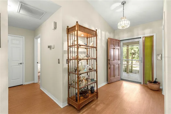 a view of an entryway with wooden floor