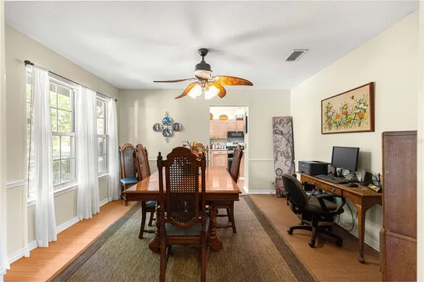 a dining room with furniture and window