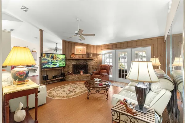 a living room with furniture and a fireplace