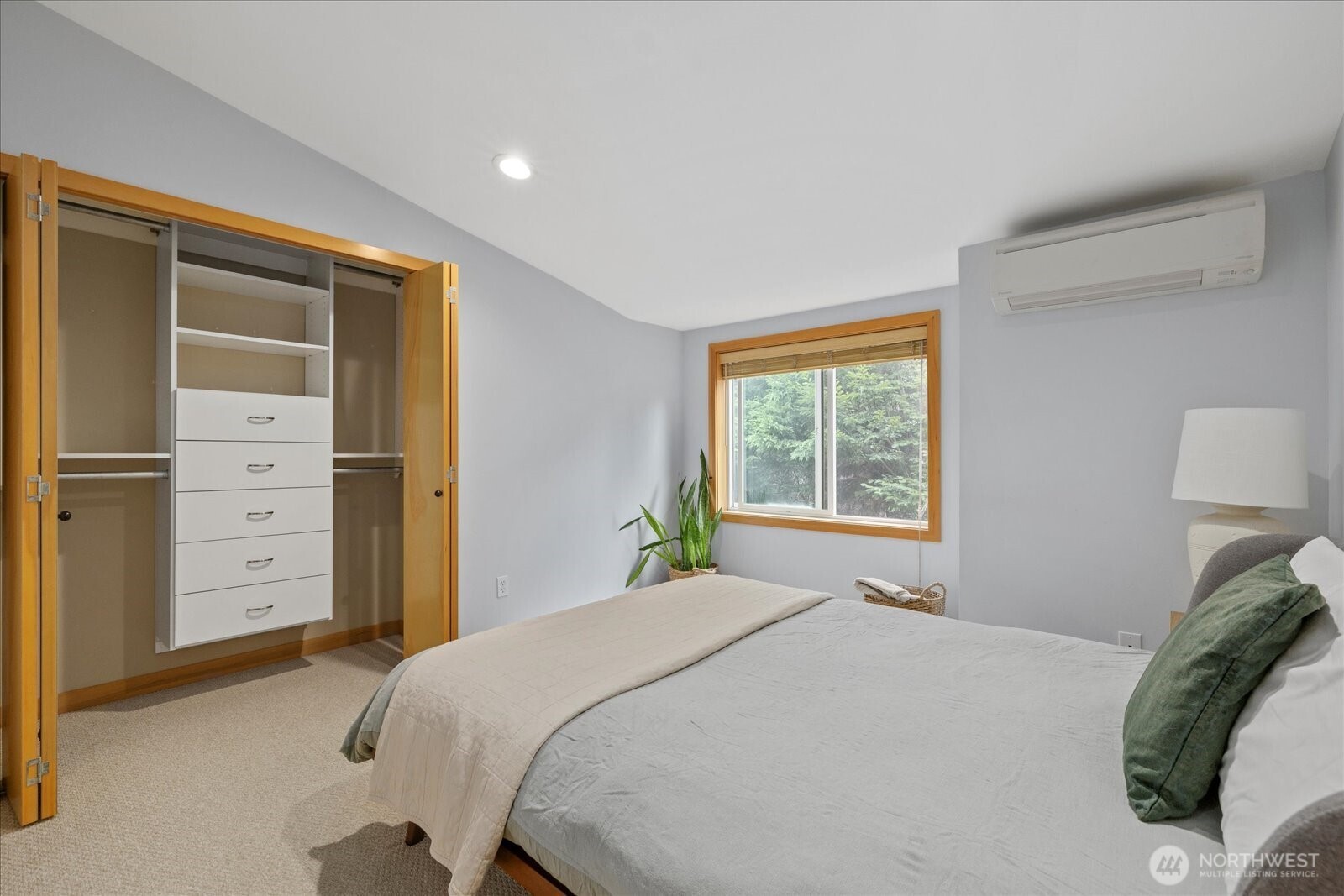 9748 4th Avenue Northwest, Unit B Seattle, WA 98117 - Photo 19 of 24 a bedroom with a bed and a closet