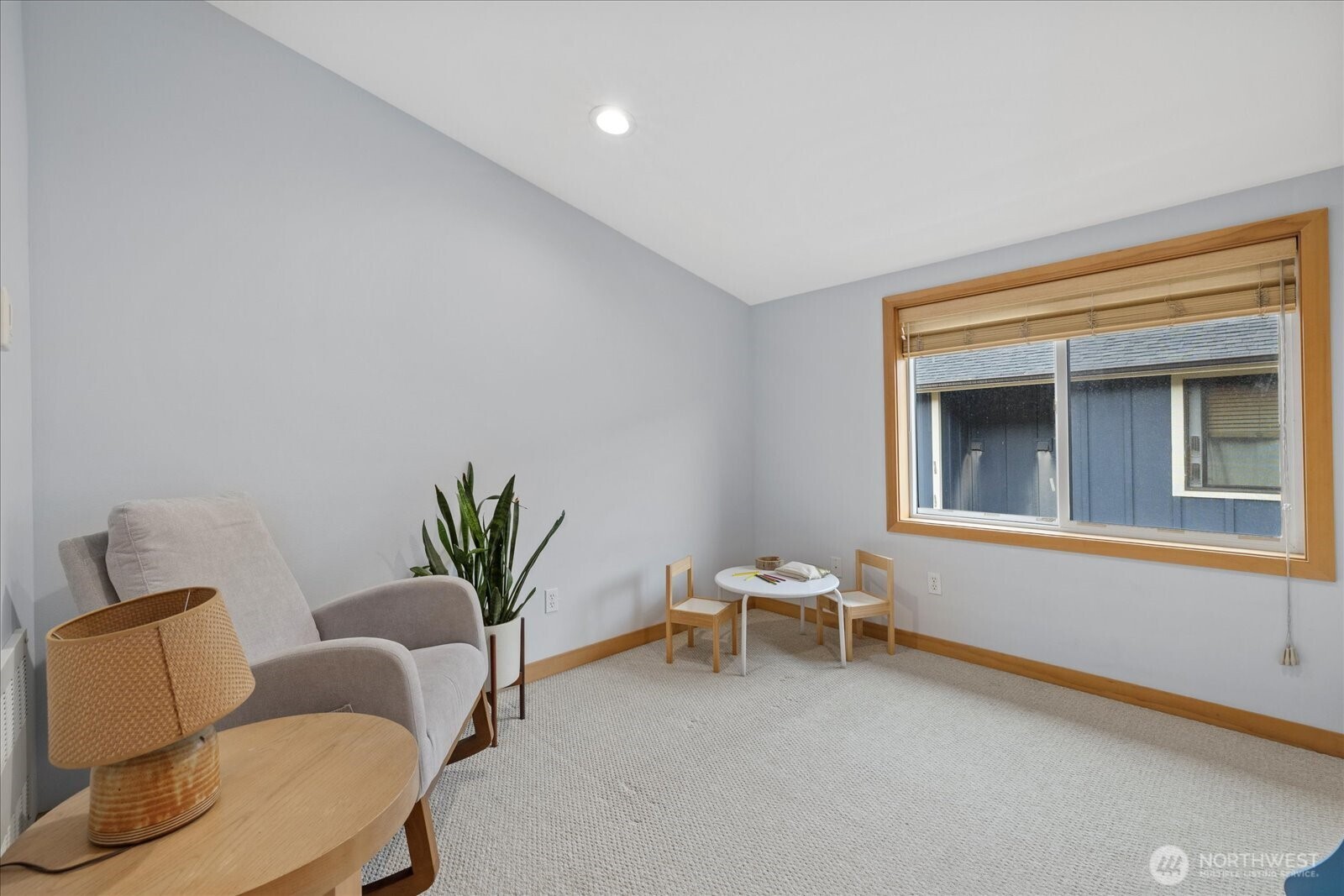 9748 4th Avenue Northwest, Unit B Seattle, WA 98117 - Photo 21 of 24 a living room with furniture and a potted plant
