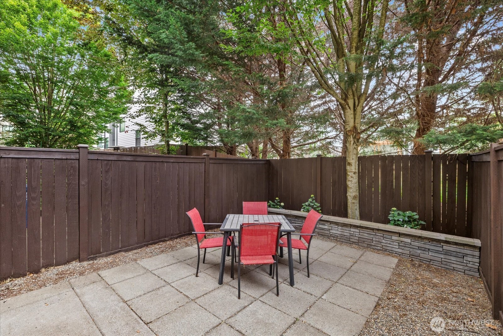 9748 4th Avenue Northwest, Unit B Seattle, WA 98117 - Photo 7 of 24 a backyard of a house with outdoor seating