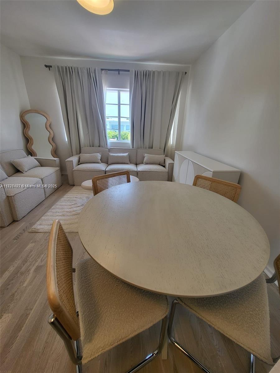 810 7th Street, Unit 206 Miami Beach, FL 33139 - Photo 3 of 7 a living room with couches and furniture