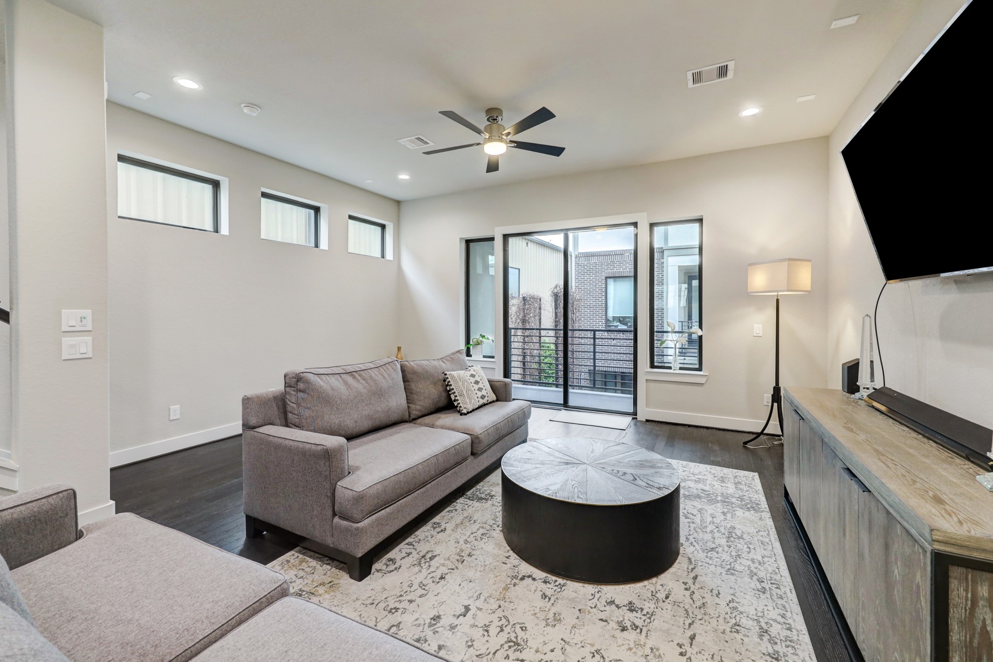 4203 Allen Street Houston, TX 77007 - Photo 10 of 35 a living room with furniture and a flat screen tv