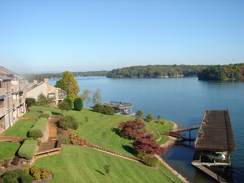 an aerial view of a house with a lake view