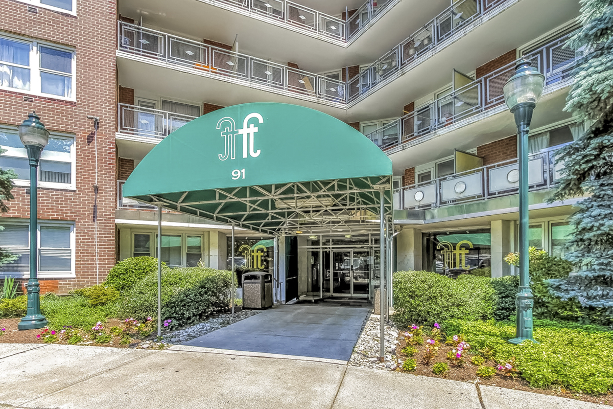 a front view of a building with garden