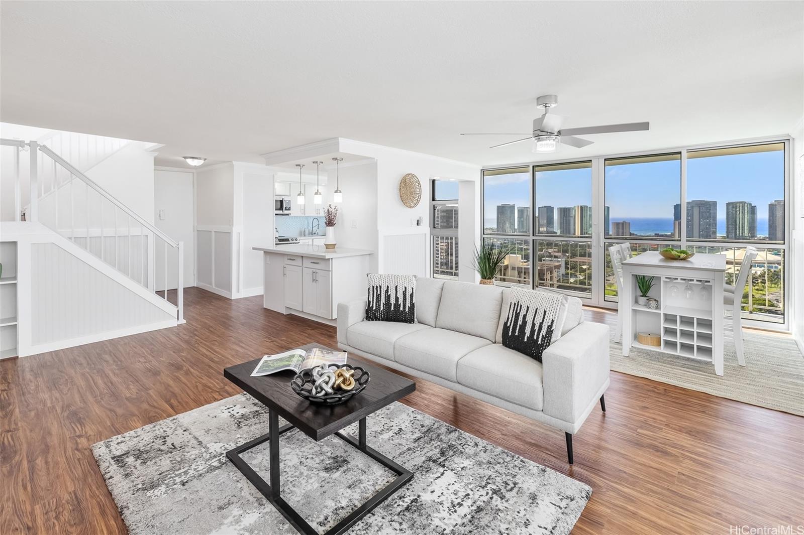 1425 Ward Avenue, Unit RGW Honolulu, HI 96822 - Photo 1 of 1 a living room with furniture and a wooden floor