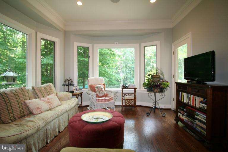 11114 Cripplegate Road Potomac, MD 20854 - Photo 11 of 30 a living room with furniture and a flat screen tv