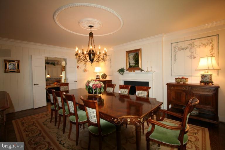 11114 Cripplegate Road Potomac, MD 20854 - Photo 16 of 30 a view of a dining room with furniture and chandelier