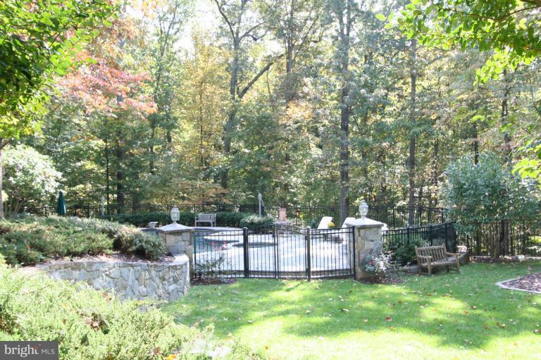 11114 Cripplegate Road Potomac, MD 20854 - Photo 23 of 30 a view of a backyard with seating area and trees