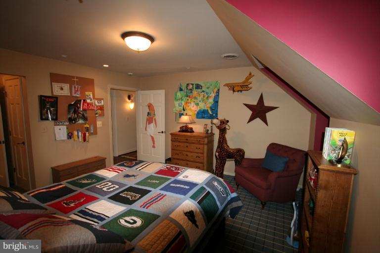 11114 Cripplegate Road Potomac, MD 20854 - Photo 6 of 30 a bed room with a bed and furniture