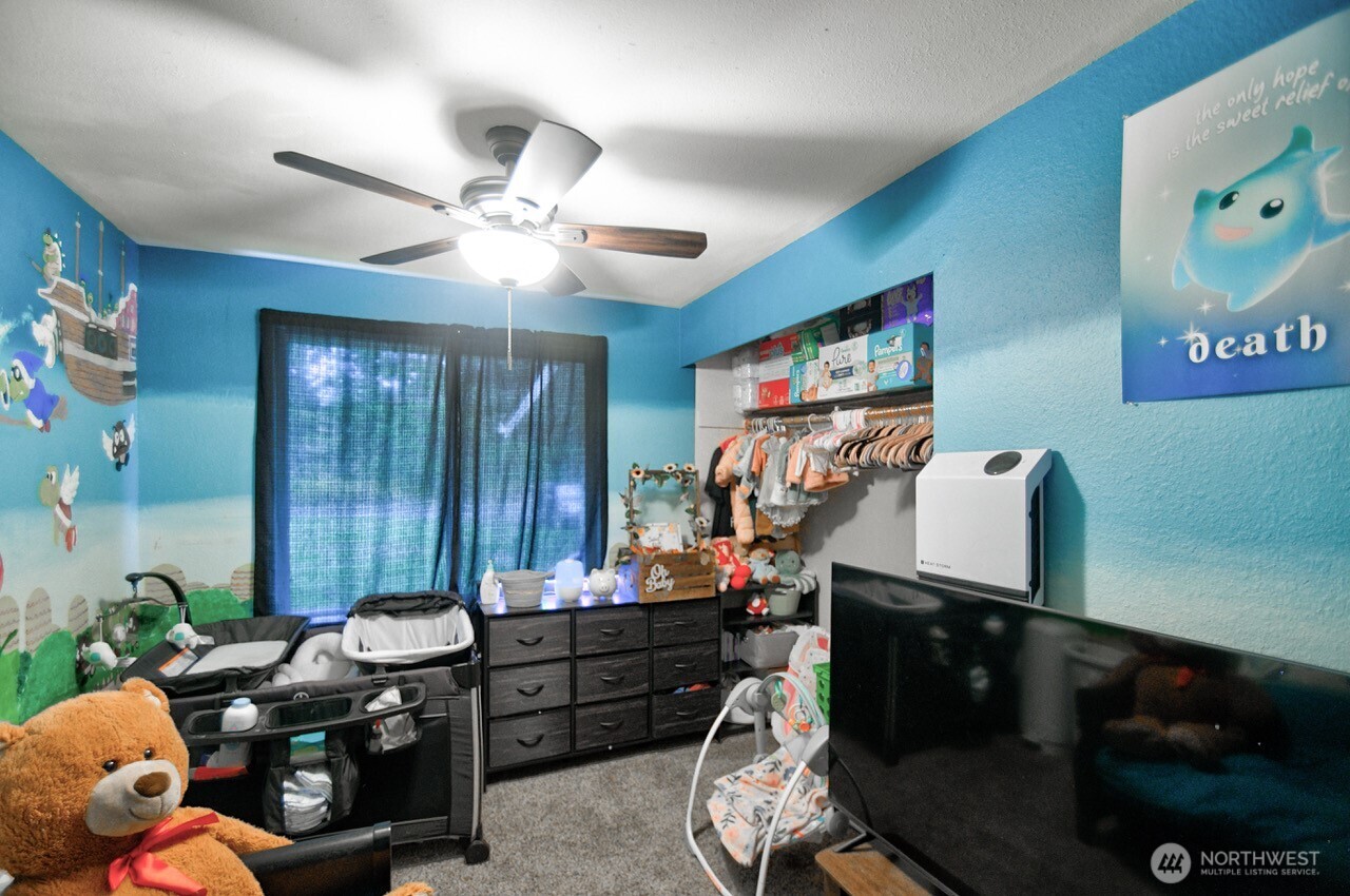 14939 Turner Road Southeast Rainier, WA 98576 - Photo 12 of 24 a room with furniture and ceiling fan