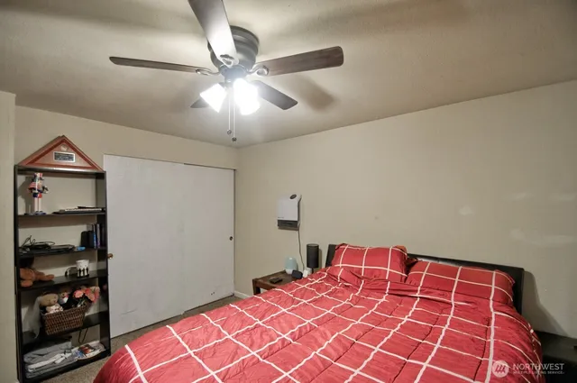 a bedroom with a bed and closet