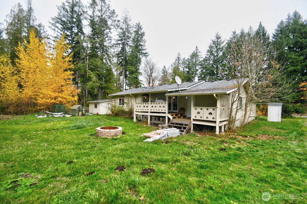 14939 Turner Road Southeast Rainier, WA 98576 - Photo 24 of 24 a front view of a house with garden and trees