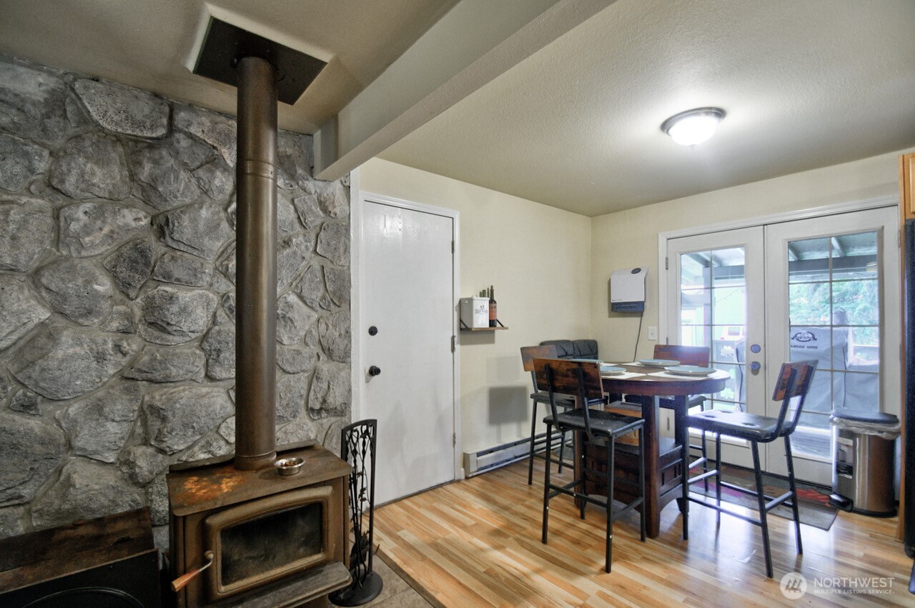 14939 Turner Road Southeast Rainier, WA 98576 - Photo 5 of 24 a view of a dining room with furniture and wooden floor