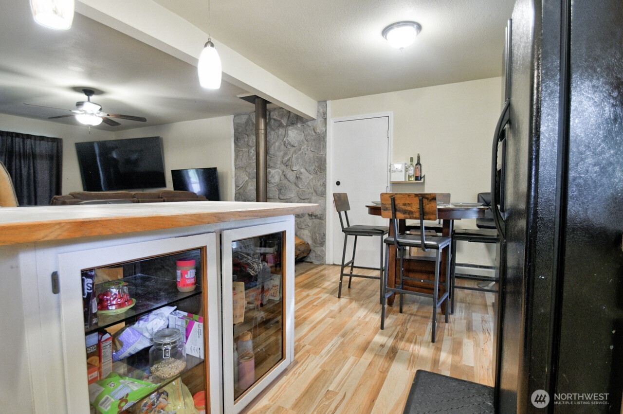 14939 Turner Road Southeast Rainier, WA 98576 - Photo 10 of 24 a view of a dining room with furniture and wooden floor