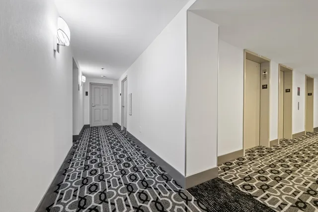 a spacious bathroom with a sink mirror and window