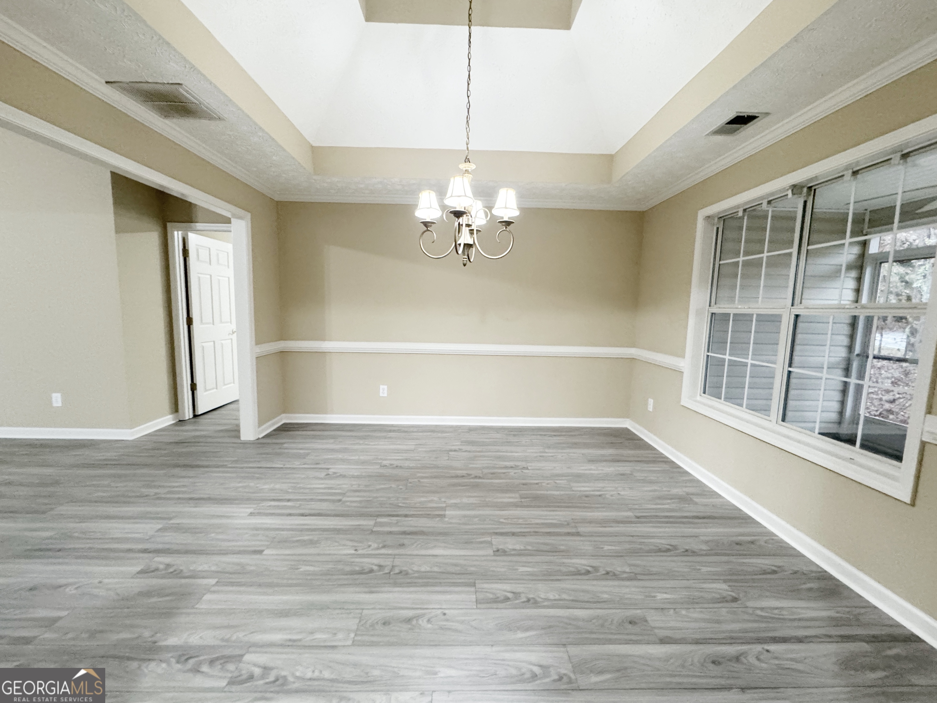 1150 Strath Clyde Way McDonough, GA 30253 - Photo 14 of 28 a view of a livingroom with wooden floor and a ceiling fan