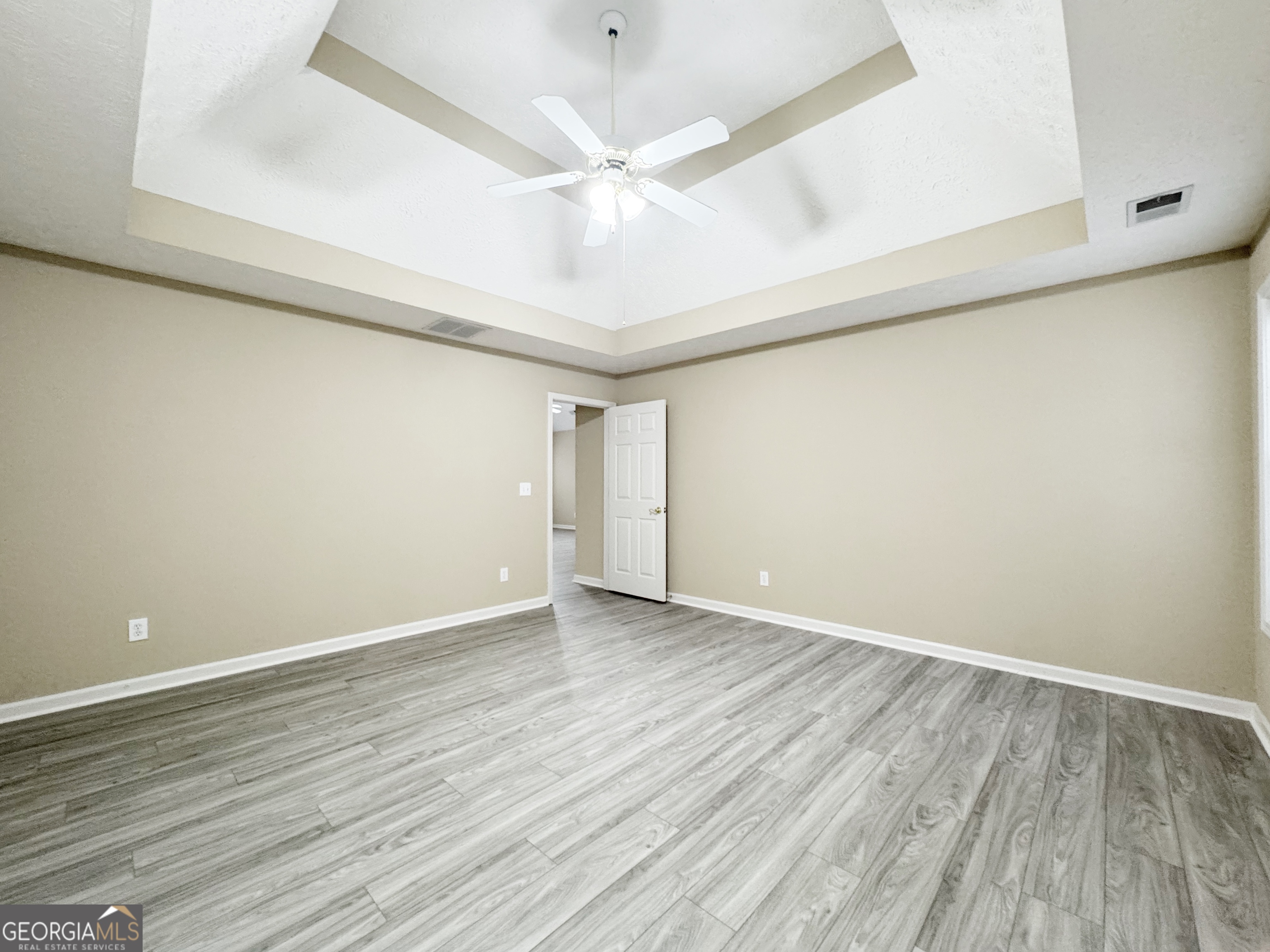 1150 Strath Clyde Way McDonough, GA 30253 - Photo 17 of 28 a view of an empty room with wooden floor