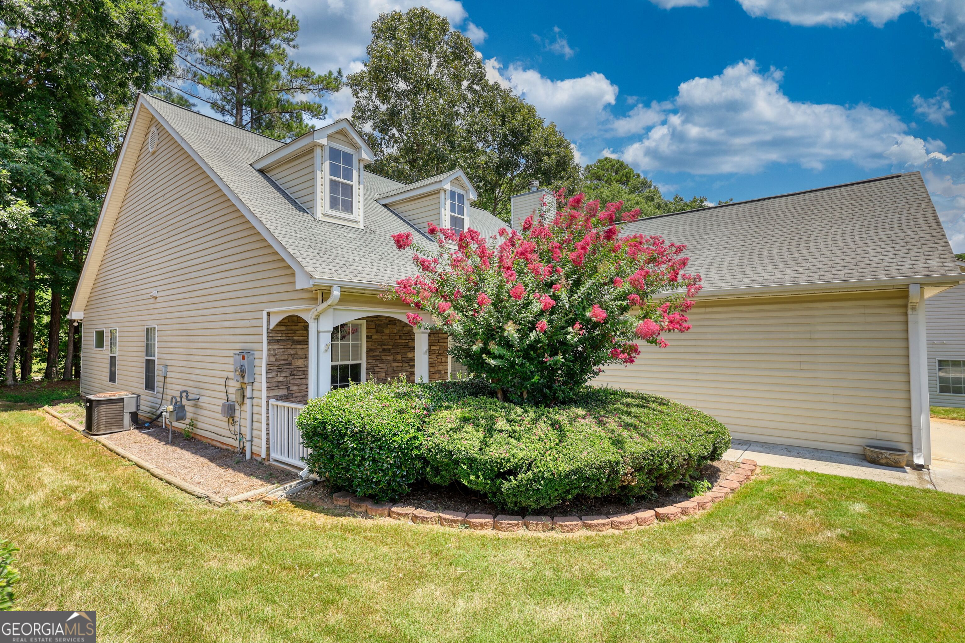 1150 Strath Clyde Way McDonough, GA 30253 - Photo 2 of 28 a view of a house with a yard and potted plants
