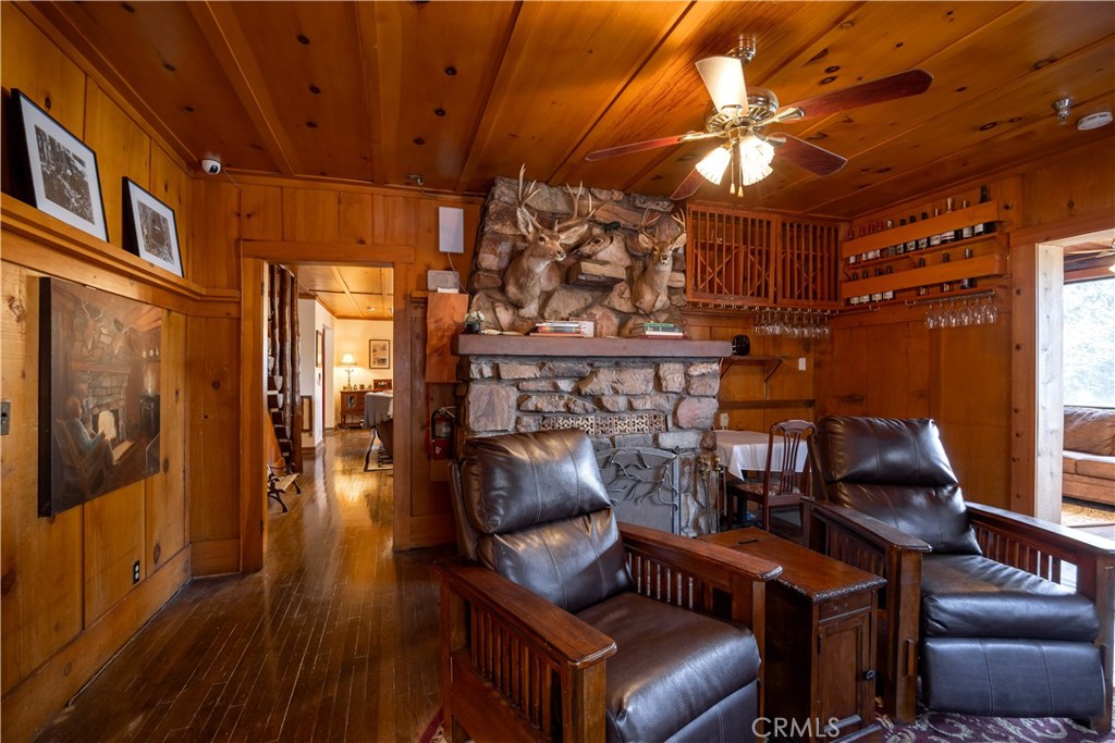 869 Knickerbocker Road Big Bear Lake, CA 92315 - Photo 11 of 50 a living room with furniture and wooden floor