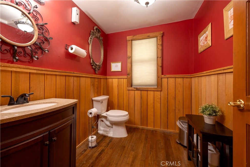 869 Knickerbocker Road Big Bear Lake, CA 92315 - Photo 14 of 50 a bathroom with a sink a toilet and mirror