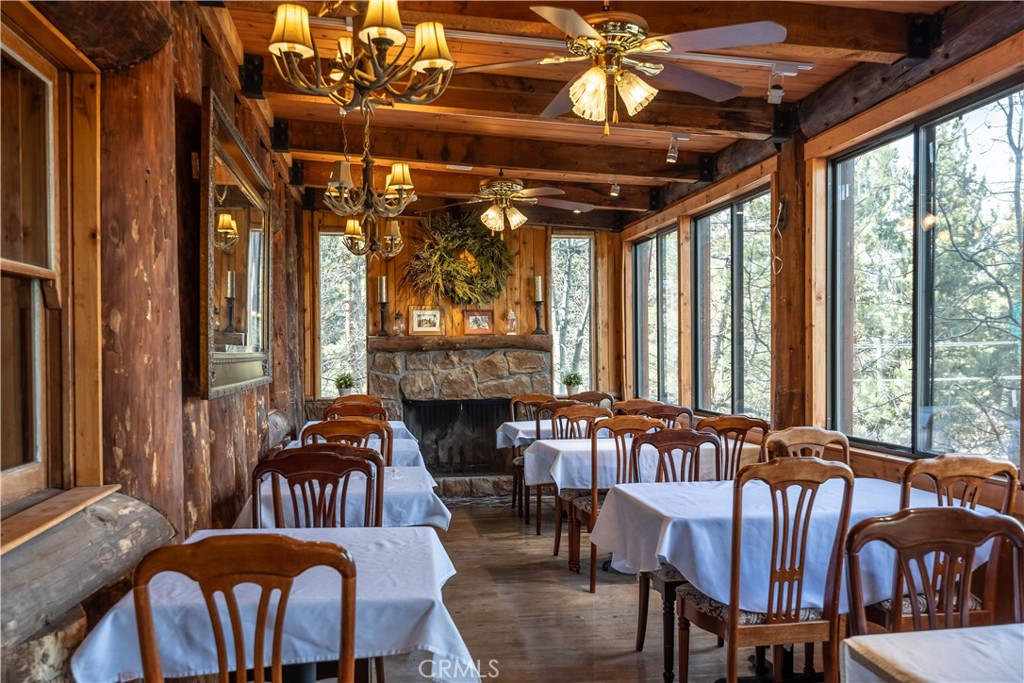 869 Knickerbocker Road Big Bear Lake, CA 92315 - Photo 16 of 50 a view of a dining room with furniture window and outside view