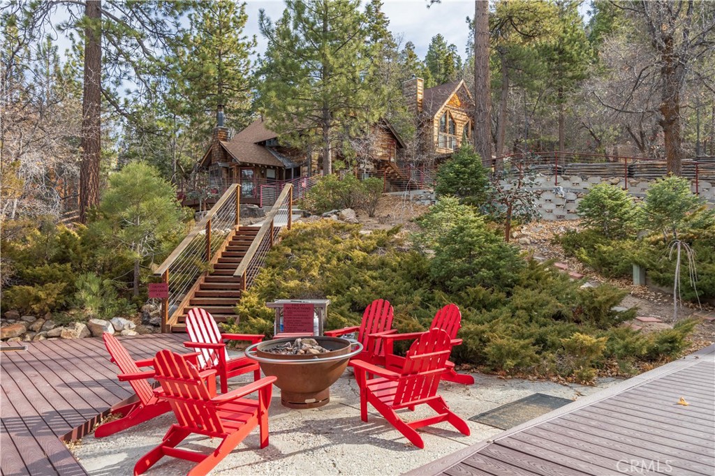 869 Knickerbocker Road Big Bear Lake, CA 92315 - Photo 33 of 50 a roof deck with table and chairs and potted plants