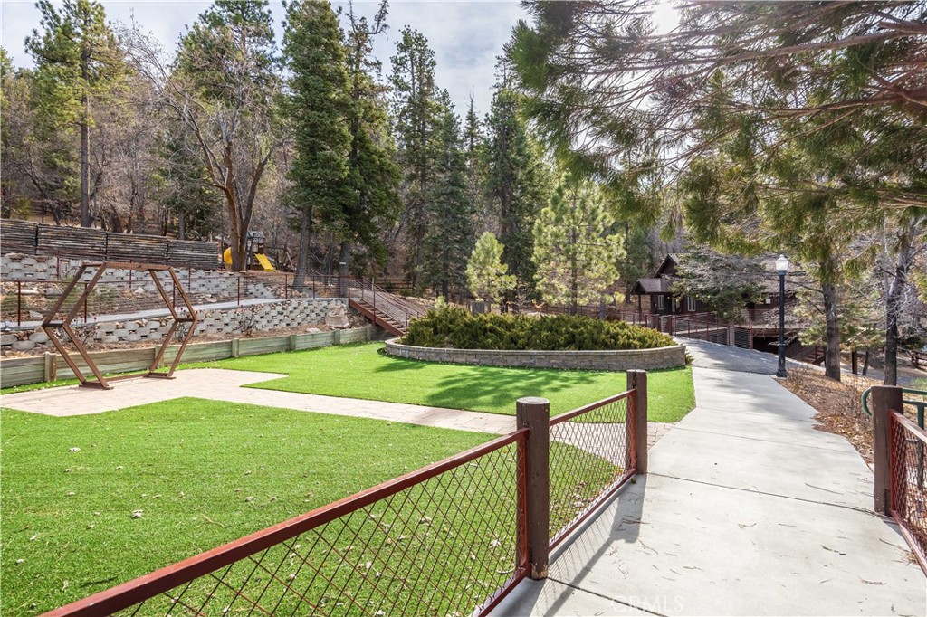 869 Knickerbocker Road Big Bear Lake, CA 92315 - Photo 34 of 50 a view of a swimming pool with a yard