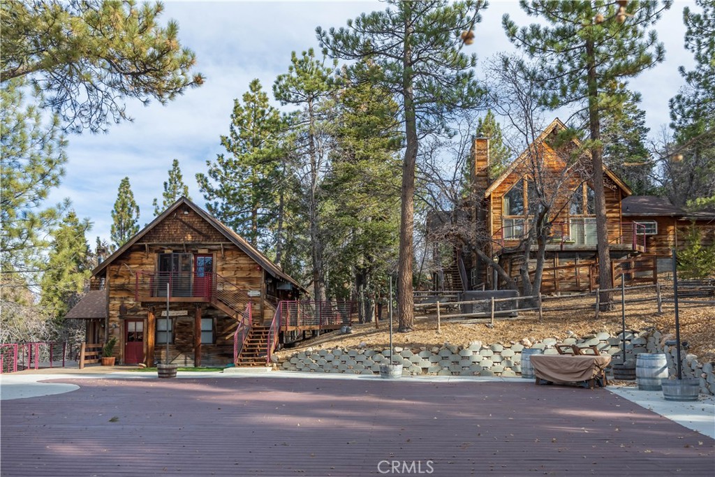 869 Knickerbocker Road Big Bear Lake, CA 92315 - Photo 38 of 50 a front view of a house with a garden