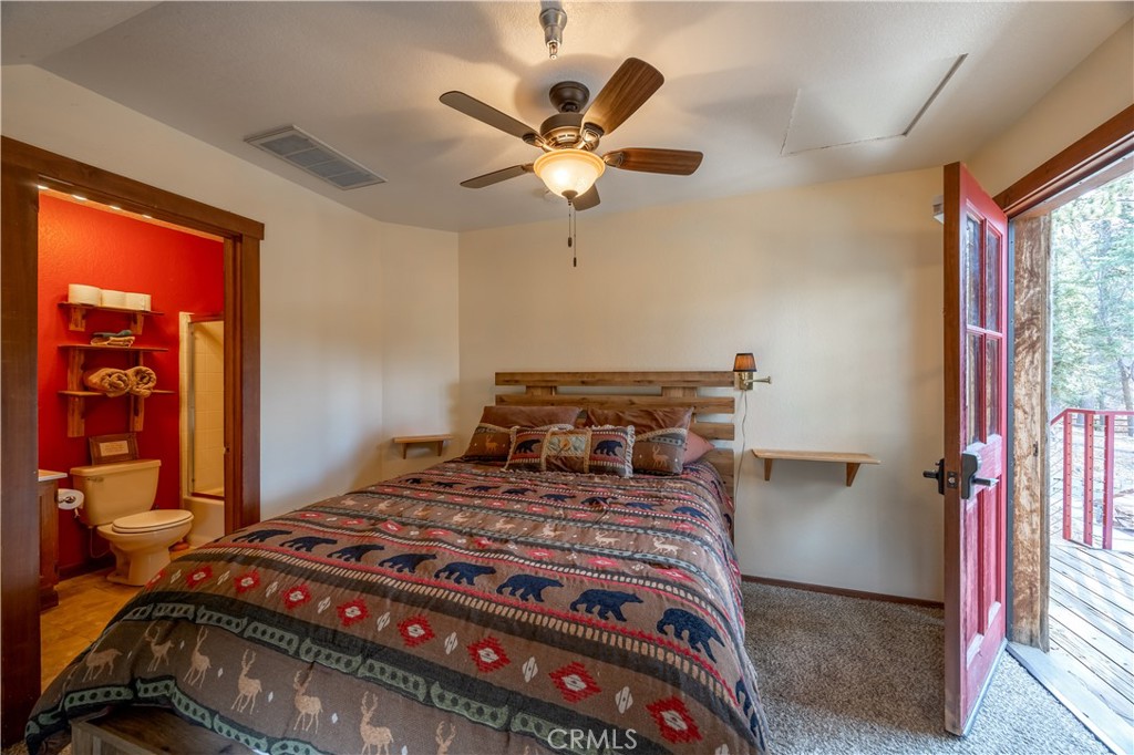 869 Knickerbocker Road Big Bear Lake, CA 92315 - Photo 39 of 50 a bedroom with a bed and window