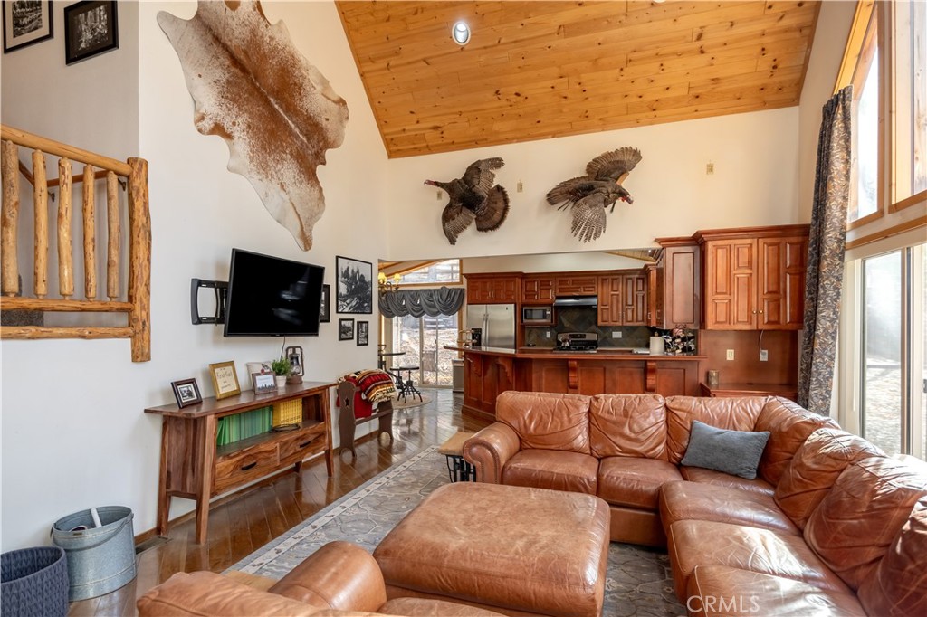 869 Knickerbocker Road Big Bear Lake, CA 92315 - Photo 42 of 50 a living room with furniture and a flat screen tv