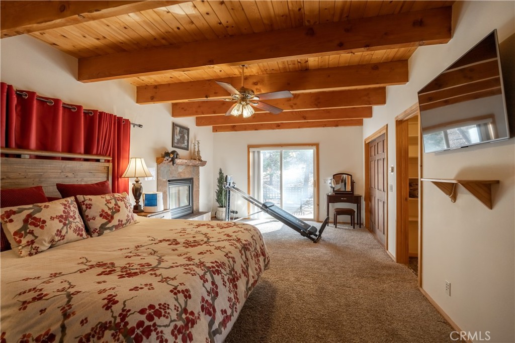 869 Knickerbocker Road Big Bear Lake, CA 92315 - Photo 45 of 50 a spacious bedroom with a bed and a walk in closet