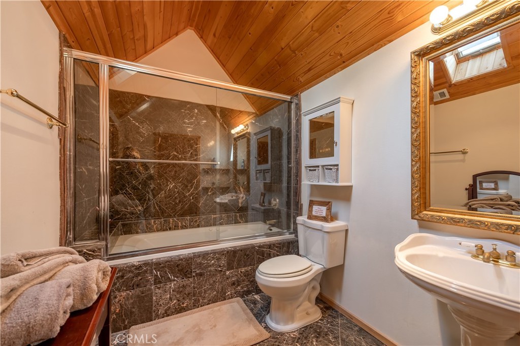 869 Knickerbocker Road Big Bear Lake, CA 92315 - Photo 48 of 50 a bathroom with a toilet sink and shower