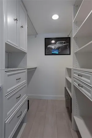 a view of an empty room and fire place