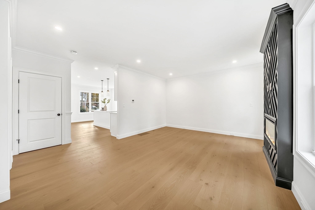57 Raymond Street, Unit 2 Franklin, MA 02038 - Photo 13 of 41 an empty room with windows and entrance