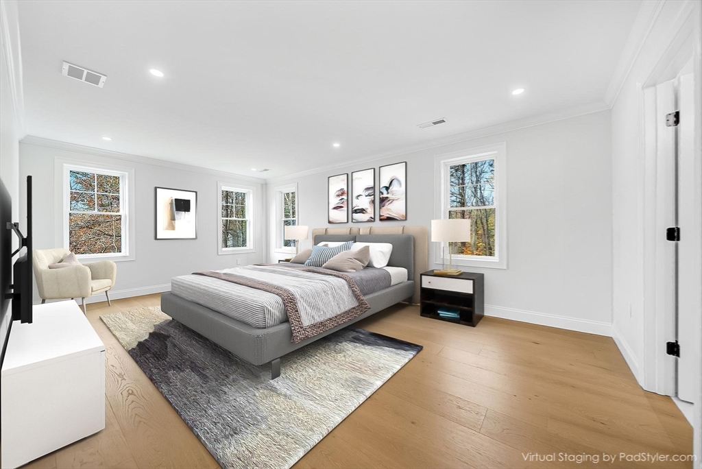 57 Raymond Street, Unit 2 Franklin, MA 02038 - Photo 20 of 41 a bedroom with a large bed and a couch