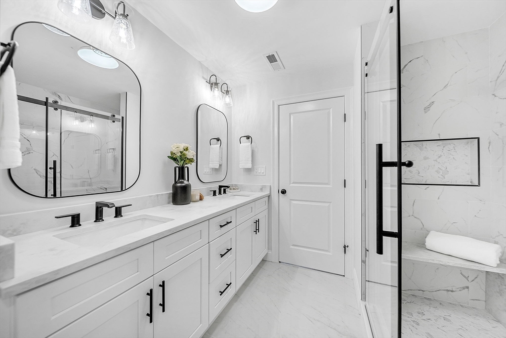 57 Raymond Street, Unit 2 Franklin, MA 02038 - Photo 23 of 41 a bathroom with a double vanity sink mirror and toilet
